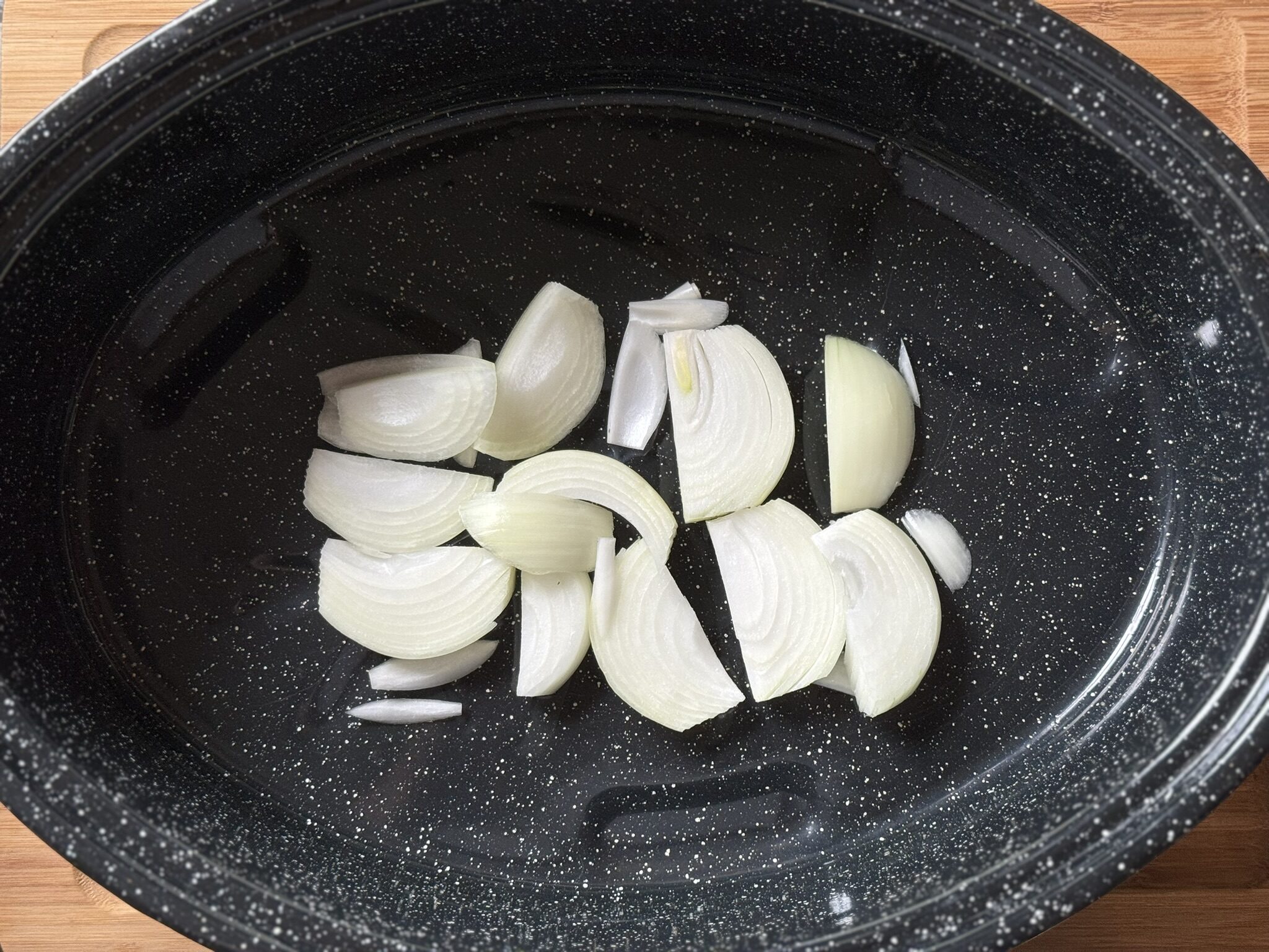 chopped onions in a roaster pan