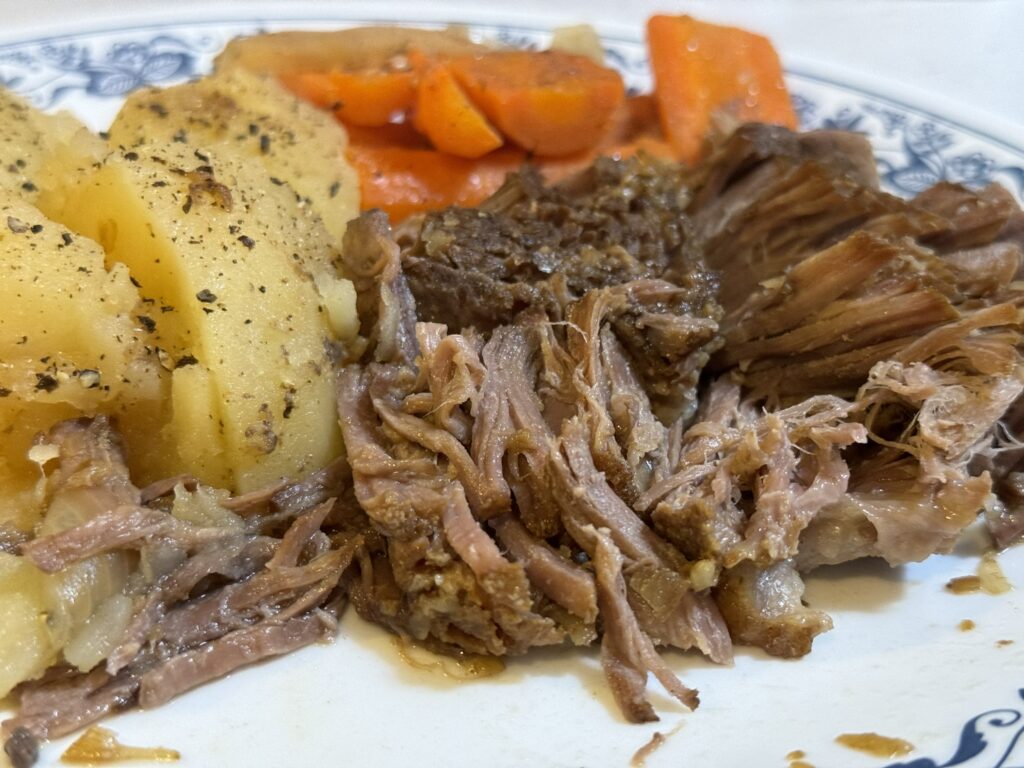 pot roast served with potatoes and carrots