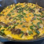 leftover steak frittata in a cast iron pan